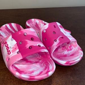 Women’s Candy Pink Crocs Slides in size 8.